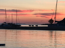 Load image into Gallery viewer, kythnos kolona beach sunset maniatis cruise goats on beach in greece
